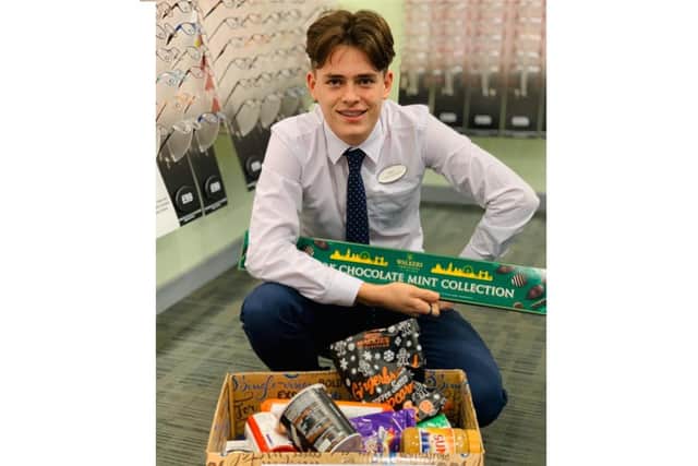 Aidan Pearce, clinical assistant at Specsavers Kenilworth with some of the items that have already been collected.