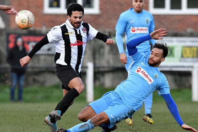 Assistant manager Justin Marsden slides into a tackle