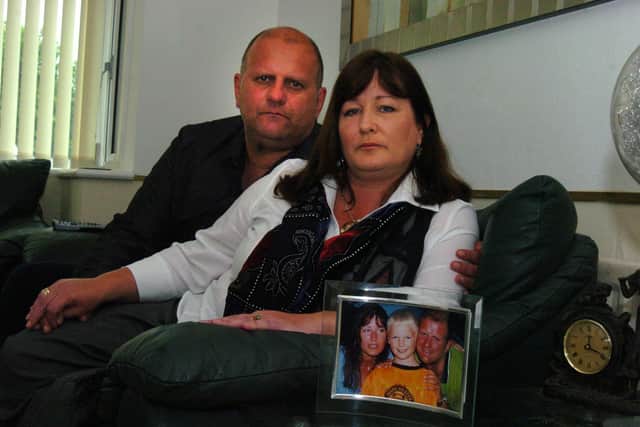 Jaxck Macleod's parents Ewan and Sheena pictured with a photograph of them with their son in 2009.