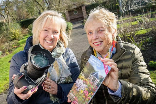 Gill Fletcher with Rosemary Mitchell who is holding a copy of the RHS Partner Gardens 2020 booklet featuring Hill Close Gardens.