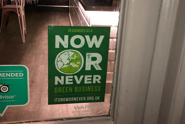 The It's Now or Never sign in a coffee shop
