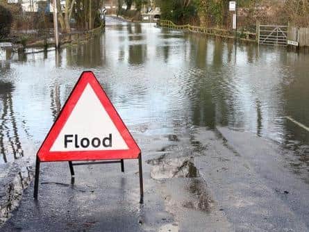 A flood warning sign posted by Warwickshire County Council officials from Storm Dennis