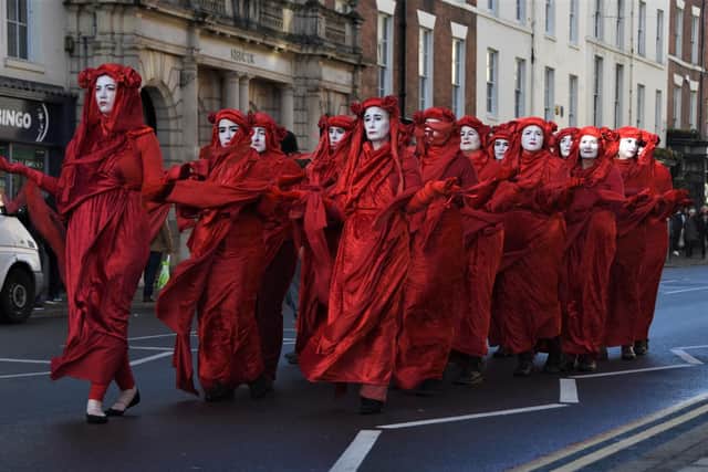 The Red Rebels, who are part of the Extinction Rebellion movement, stage a climate change protest in Leamington. Photo by Kevin Ward.