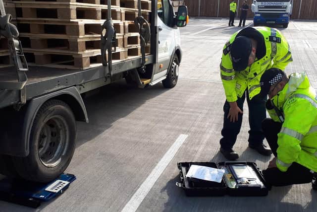 Officers check a vehicle's weight. Photo by Warwickshire Police