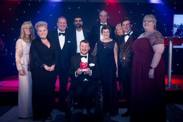 Winner fo the Accessible and Inclusive Award, Fleetwood Beach Wheelchairs with Tez Ilyas and Lancashire Ambassador Michael Conlon.