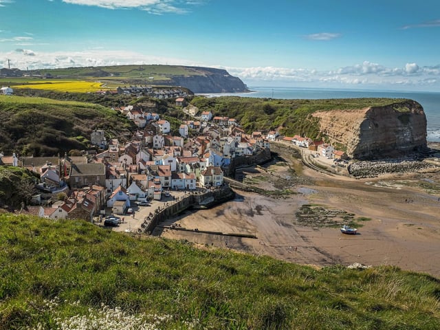 The eminently photographic fishing village of Staithes is reckoned by many to be the prettiest on the east coast. Sitting within the shelter of the harbour and backed by the seafront is a small sandy beach