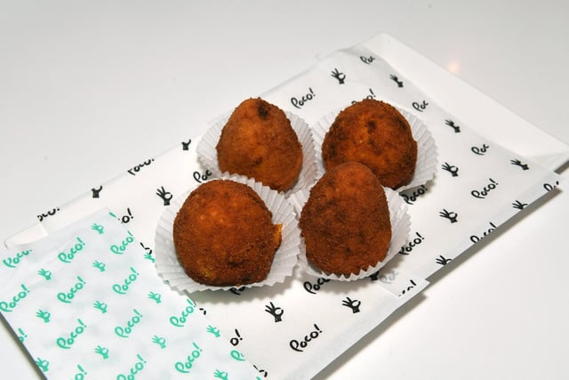Food which includes the delicious arancini - rice balls that are stuffed, coated with bread crumbs and deep fried.
