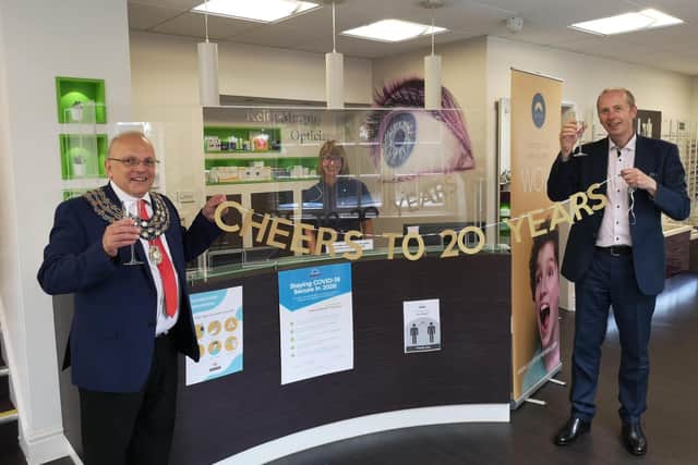 Kenilworth Mayor Richard Dickson and Optometrist and co-founder Keith Murphy celebrating the milestone at the practice on Warwick Rd.