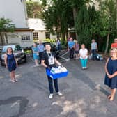 (Front, left to right) Rugby Borough Council's Sam O'Brien and Hope4 chair Diana Mansell with the charity's volunteers ready to return to Rugby Foodbank.