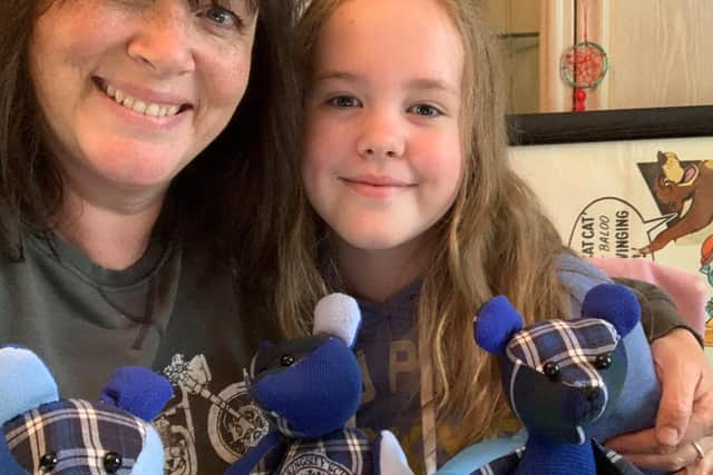 Julie with her daughter Harriet and some handmade bears. Photo supplied