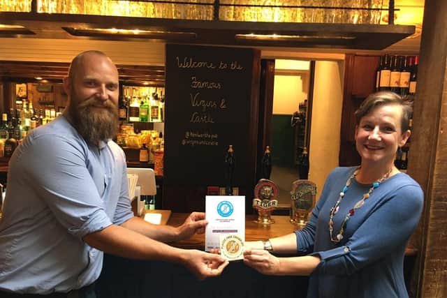 Marc Hornby, co-owner of the The Famous Virgins & Castle pub, with Alison Firth of Plastic Free Kenilworth.