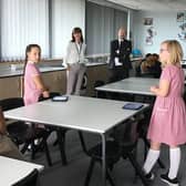 Rugby MP Mark Pawsey observes a socially distanced lesson by Mr Payne at Rugby Free Primary School.