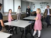 Rugby MP Mark Pawsey observes a socially distanced lesson by Mr Payne at Rugby Free Primary School.