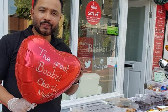 Baabzi outside the takeaway for his charity evening. Photo submitted