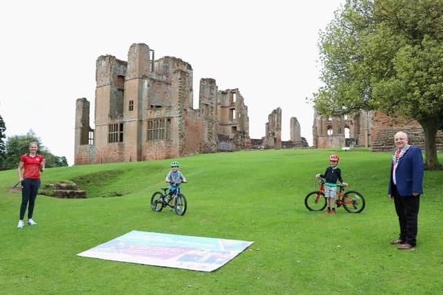 Photographed marking the countdown at Kenilworth Castle are; the Mayor of Kenilworth, Cllr Richard Dickson, Commonwealth Games Medallist Sarah-Jane Perry and local school children Rmi and Lon.