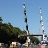 The 128 tonne, 35.4 metre concrete bridge being safely removed in April. Photo by Highways England