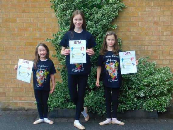 Pupils of Alison Fuller's School of Dance show off their certificates and t-shirts.