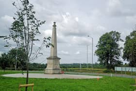 Newly-planted saplings complement the lime trees on the island at the memorial.