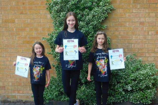 Three sisters wearing their t-shirts and holding their certificates. Photo and caption provided by Alison Fuller's school of dance