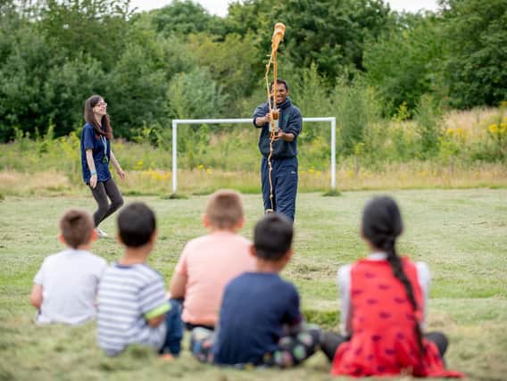 Play rangers Melissa Tallis and Danny Mistry entertain youngsters with a fun science demonstration.