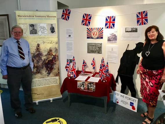 Philip Wilson, Warwickshire Yeomanry Museum Trustee and archivist, and Liz Healey, visitor centre manager next to the display. Photo supplied