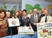 Matt Western celebrates the 70th birthday of the NHS with staff.