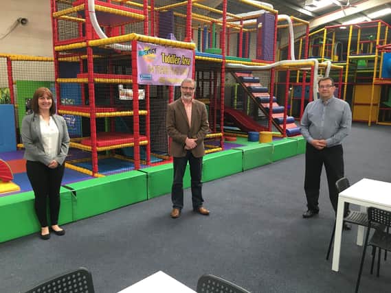 Rugby MP Mark Pawsey (centre) with Darren Malt (right) and Lorraine Malt (left) at The Adventure Zone in Rugby.