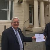 Michael Coker is pictured outside the Regent Hotel, where he joined the Royal Leamington Spa Rotary Club 50 years ago, being presented with his celebratory certificate by club president Michael Heath.