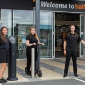 L-R: Halfords staff members Gemma and Emily, store manager Darren Grieves and Rugby MP Mark Pawsey.