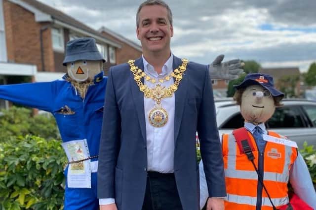 Mayor Terry Morris with some of the scarecrows. Photo supplied