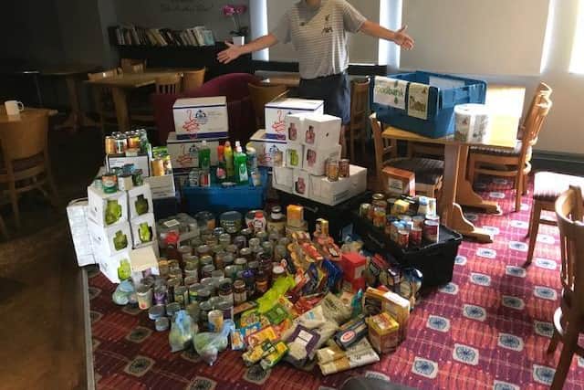 Martin Goode, landlord of the Woodloes Tavern with the donations for the foodbank. Photo supplied