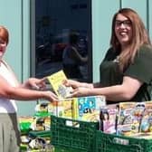 Pictured left to right: Packmores Community Centre’s Local Engagement Officer Debbie Behan is presented with children’s books donated by Leamington Morrisons’ customers, by the supermarket’s Community Champion, Alex Pearson. Photo supplied