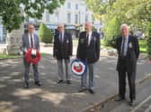 Matt Western MP with his wreath ready for laying; Stuart Powney, branch chairman; David Brown one of the senior members of the branch with the branch wreath; Sqdn. Ldr. (Retired) Patrick Fitzgerald, branch secretary, awaiting the arrival of Father Christopher Wilson to conduct the service.
