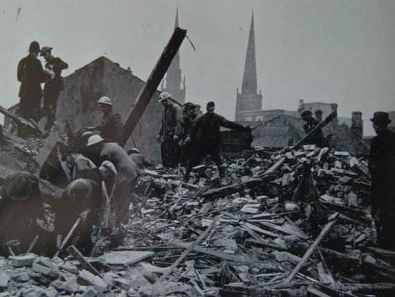 Volunteers and emergency services digging through the rubble in the aftermath of an attack.