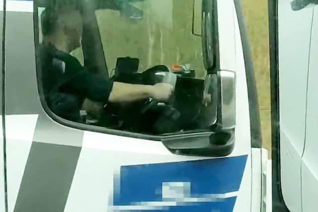 A lorry driver captured watching a film while behind the wheel near Leamington.