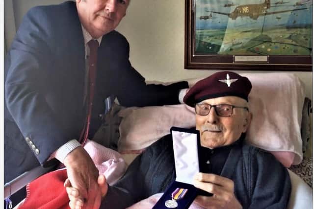 Robbie Thacker from Bedworth Para Association presenting Luis DiMarco with the 75th Operation Market Garden commemorative pin badge. Photo supplied