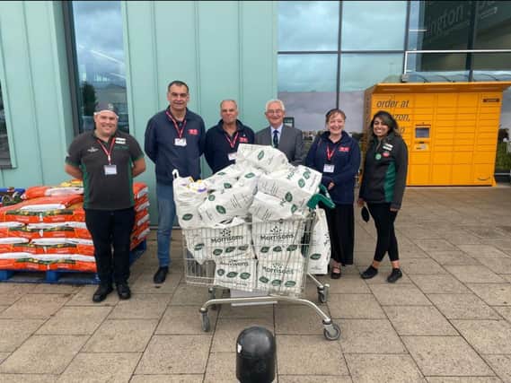 Nick and Dawn Caswell and Tam Webster of Veterans Contact point accepting food donation from staff at Morrisons.  Also present was Councillor Redford of Warwickshire County Council representing the CSW Armed Forces Covenant Partnership.