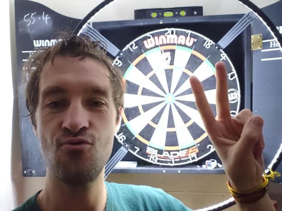 Dan Squire set himself the challenge of trying to score 180 on a dart board. Photo submitted