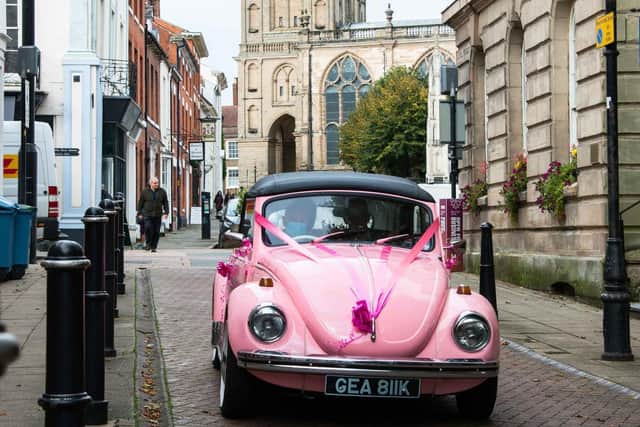 The couple arrived in a pink VW Beetle as part of the surprise. Photo by Gill Fletcher