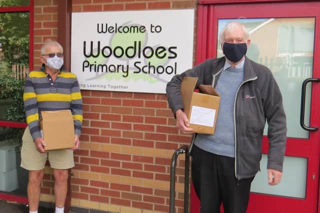 Warwick Rotary Club president David Brain with past president David Smith delivering dictionaries to Woodloes Primary School. Photo submitted