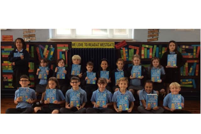 Some of the pupils from Westgate Primary School with their dictionaries. Photo supplied