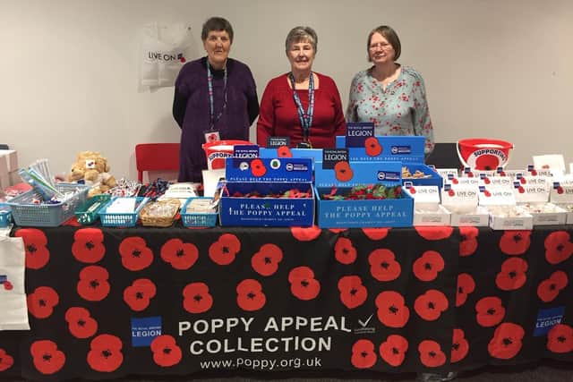 Left to right shows: Lilian Brocklehurst, Patricia Edgington and Margaret Mitchell inside the poppy store in 2019.