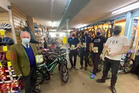 Warwickshire Police and Crime Commissioner handing over copies of the Ultimate Guide to Cycling magazines at John Atkins Cycles in Leamington. Photo supplied