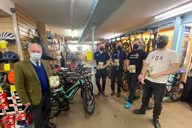 Warwickshire Police and Crime Commissioner handing over copies of the Ultimate Guide to Cycling magazines at John Atkins Cycles in Leamington. Photo supplied