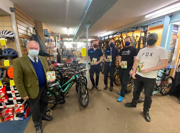 Warwickshire Police and Crime Commissioner handing over copies of the Ultimate Guide to Cycling magazines at John Atkins Cycles in Leamington. Photo supplied