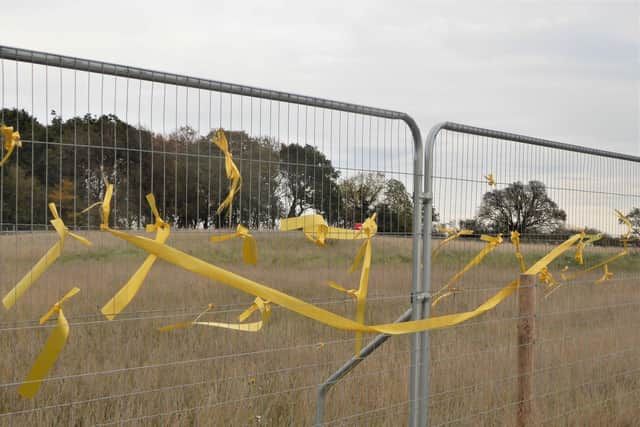 Yellow ribbons were tied to the fence keeping people away from HS2 works in South Cubbington Wood. They were put there in tribute to the ancient wild pear tree which was felled as part of the work today (Tuesday October 20). Photo courtesy of  Frances Wilmot.