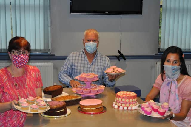 Judging the bake-a-cake competition: head of family law Andrew Brooks with family lawyers Louise Sheasby (left) and Sophia Mellor.