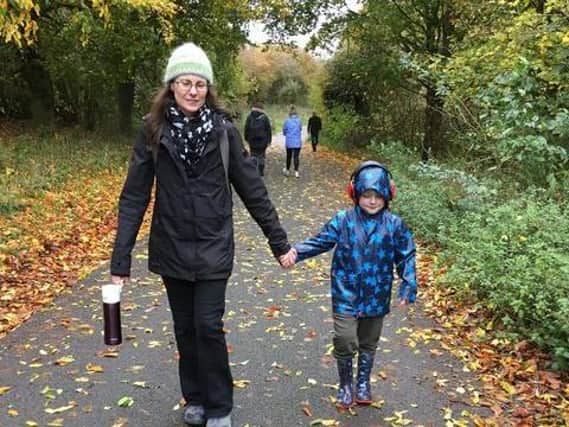 Logan and his mother brave the cold to walk two miles.