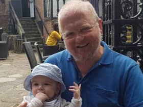Dave Evans with his grandson. Photo supplied