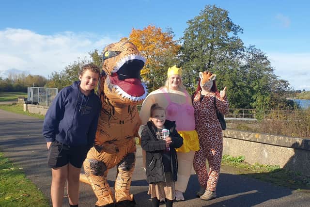 Chris and Liv with Zoe Kenny in fancy dress with Mikey Hammond and Scarlett Hammond after the fourth lap around Dracote Water. Photo supplied